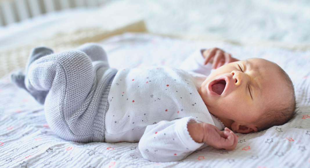 A newborn yawning.