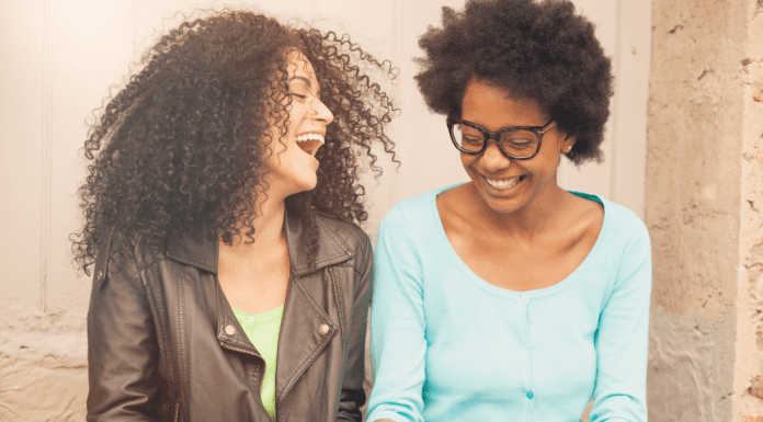 Two women laughing.