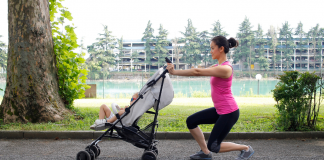 A woman exercising with a stroller.
