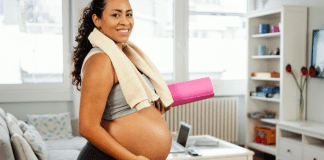 A woman exercising while pregnant.