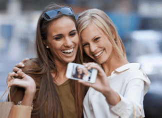 Two women taking a selfie while shopping.