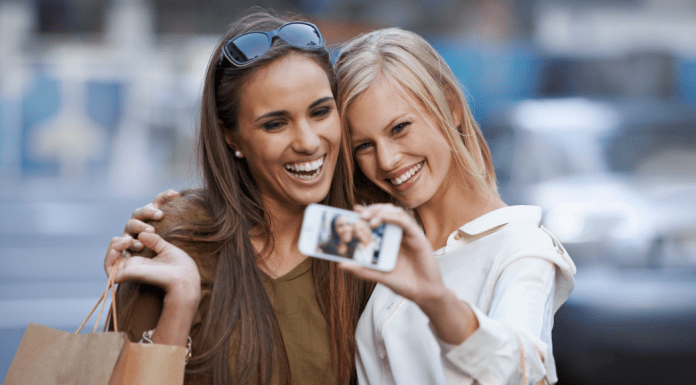 Two women taking a selfie while shopping.
