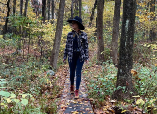 Janice walking along a path in the fall.