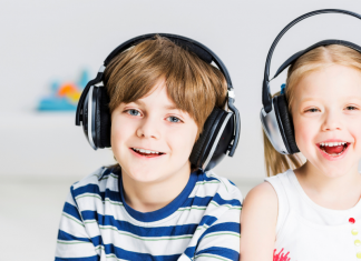 A boy and a girl wearing headphones.