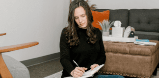 A woman writing.
