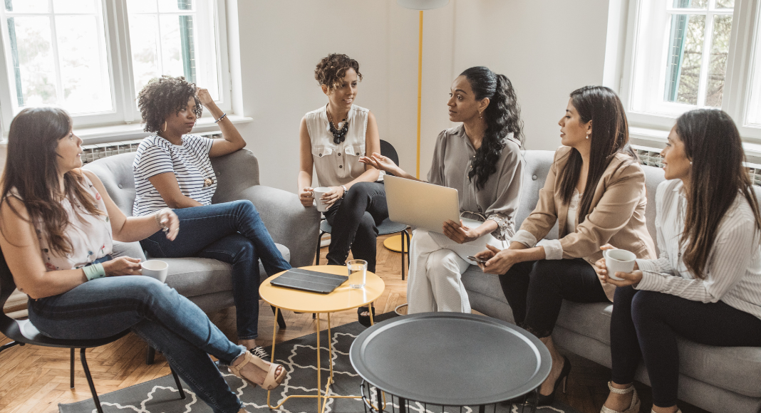 A group of women networking. 