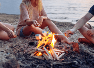 Roasting marshmallows on a bonfire.