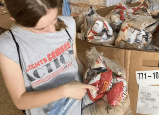 A girl packing food.