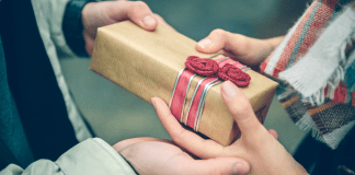 Someone giving a gift.