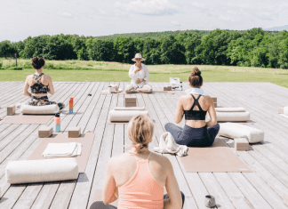 Women on an outdoor yoga retreat.